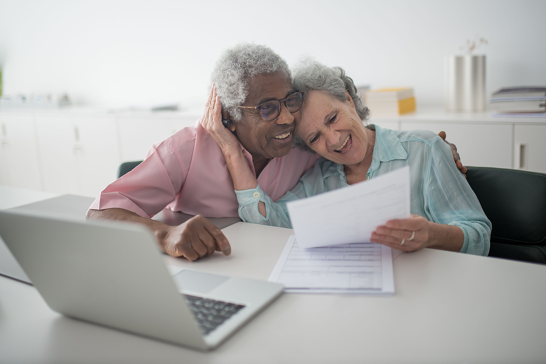 Older couple reviewing retirement documents together